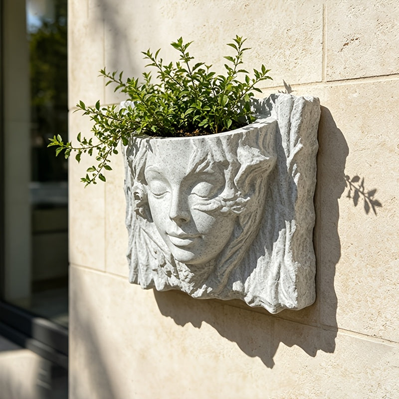 Cache-pot mural visage de déesse en résine effet pierre claire