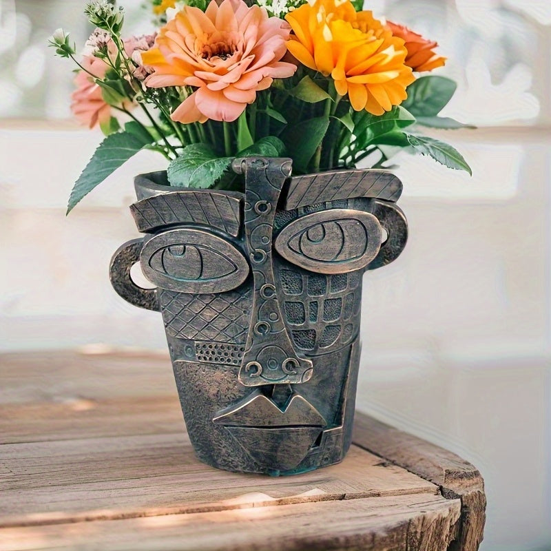Pot de fleur design visage abstrait en résine effet bronze