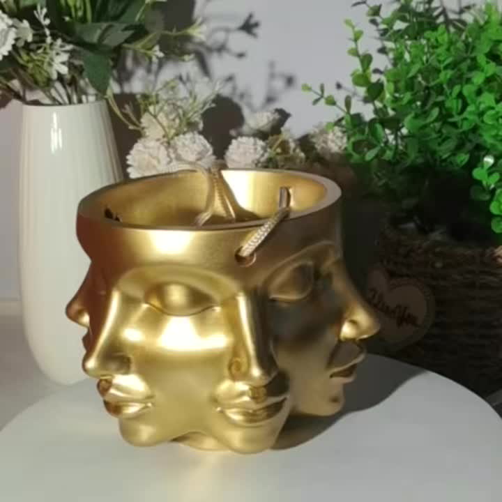 Pot de fleur suspendu doré à visages sculptés en résine Ø 15 cm